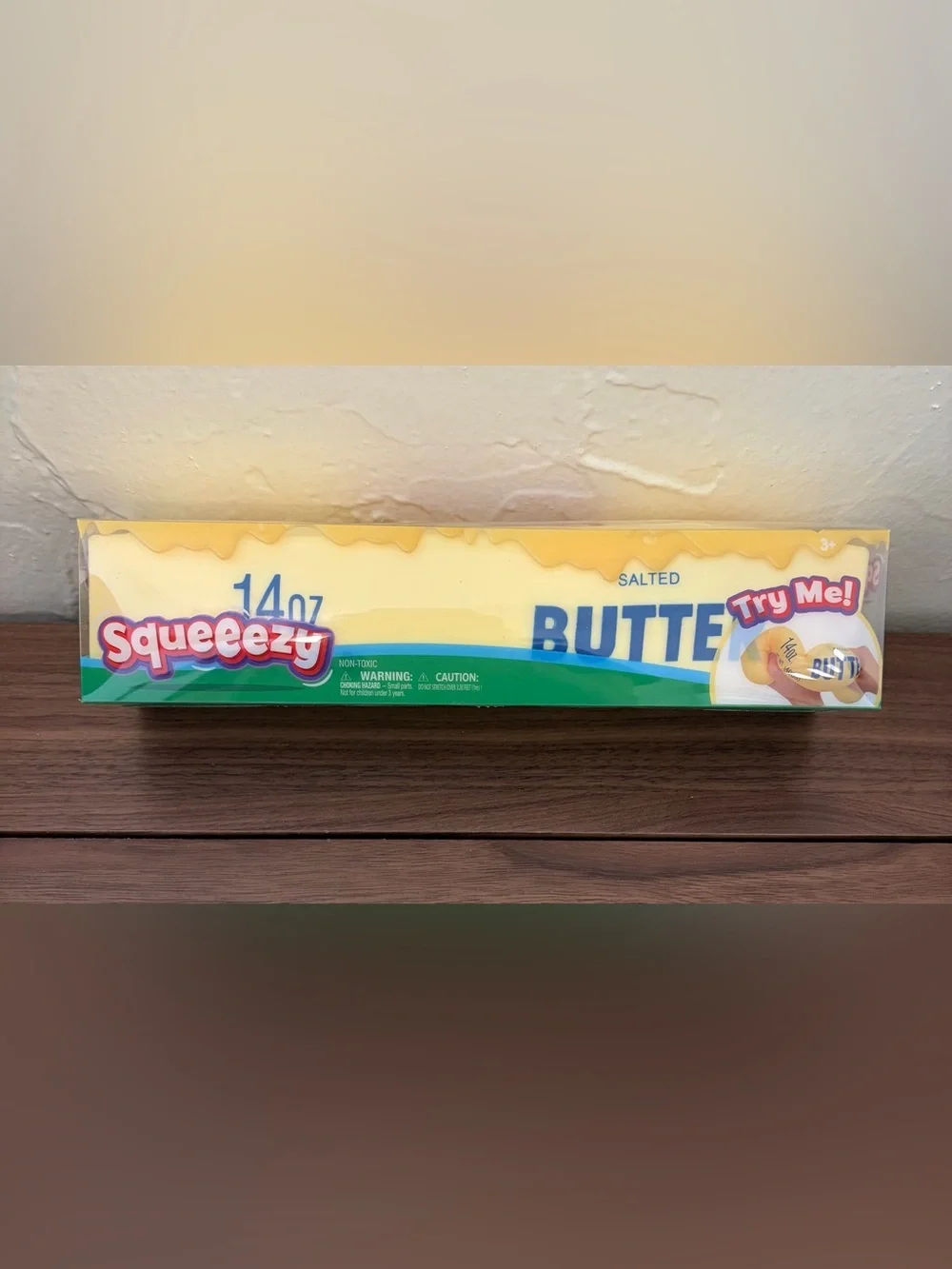 Fun oversized Squeezy squishy toy designed to look like a 14 oz stick of salted
